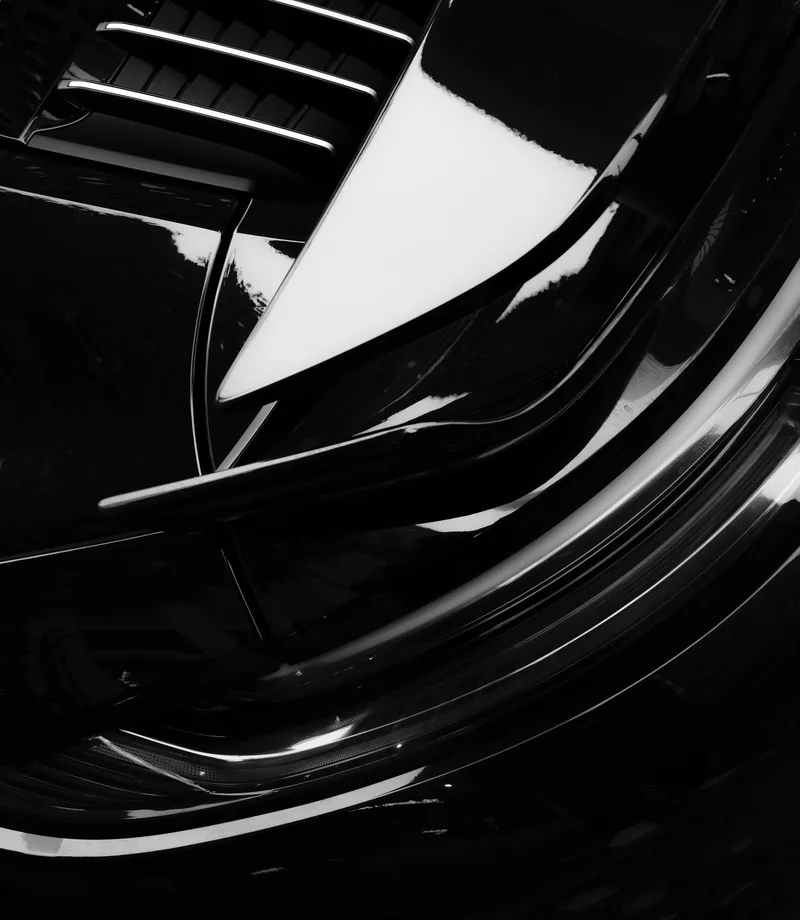 A study of polished black bodywork and precise rear-engine grille details